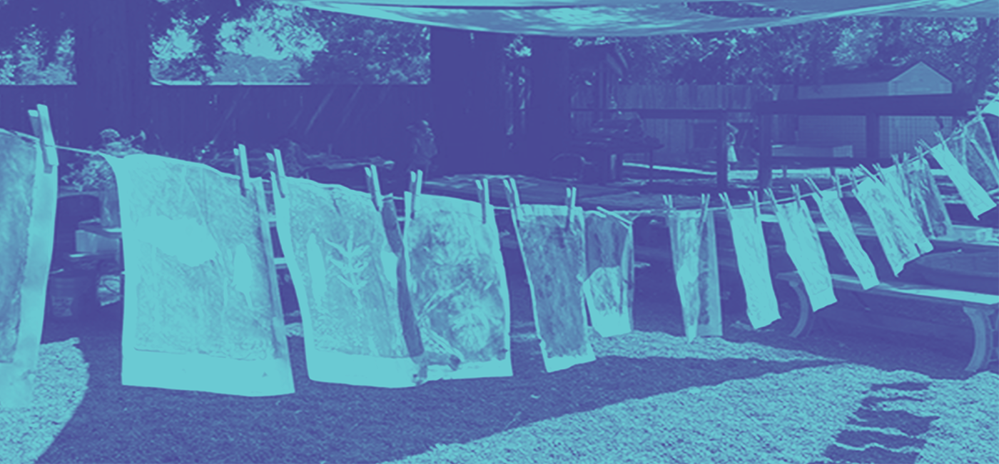 Prints hanging on clothesline to dry